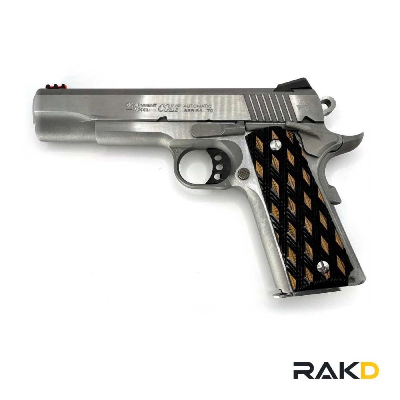 A stainless Colt Government Model Series 70 pistol, right side, with diamond-pattern grips and a fiber-optic front sight.