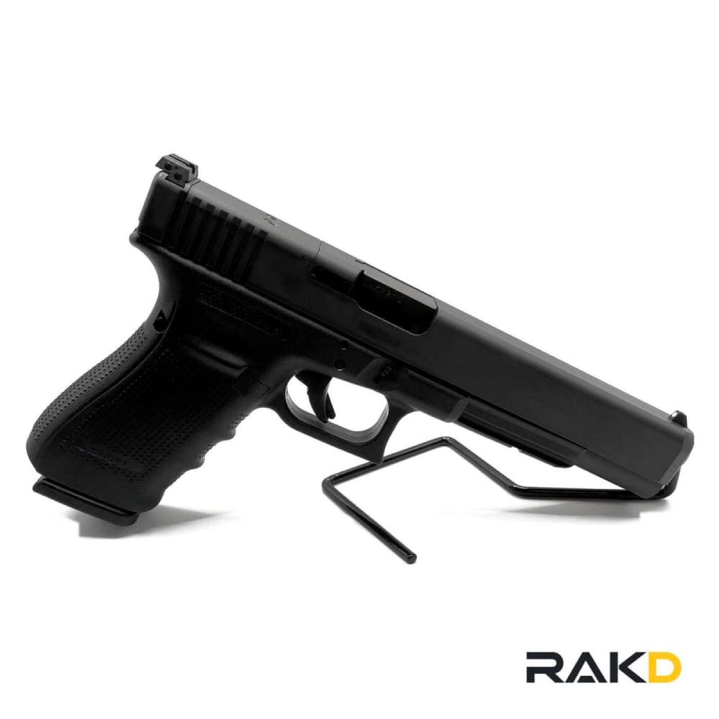 A long-slide Glock 40 pistol on a wire display stand, showing the optic cut in the slide and the adjustable rear sight.